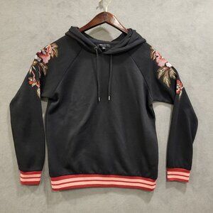 Romeo & Juliet Couture Black Hoodie with Floral Embroidery and Red Trim